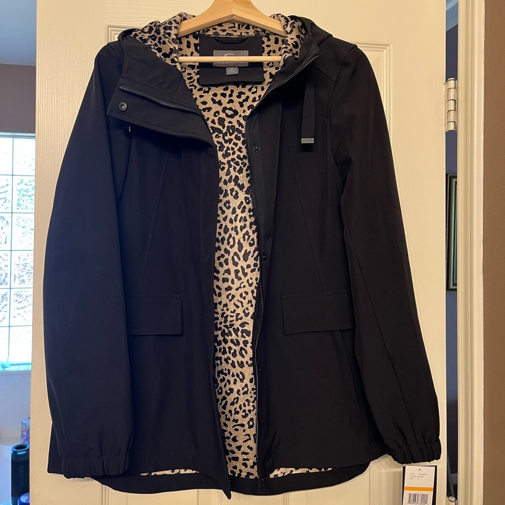 Stylish black raincoat with leopard print on the inside